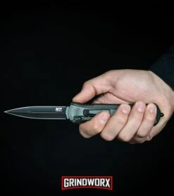 Smith & Wesson Spring Assisted Finger Actuator Spear Point OTF - Black Serr 15 Smith & Wesson Spring Assisted Finger Actuator Spear Point OTF - Black Serr -Best Knifes Shop MP OTF Spring Assisted Spear Point Knife Gray Black BHQ 80731 kp in hand web large 1